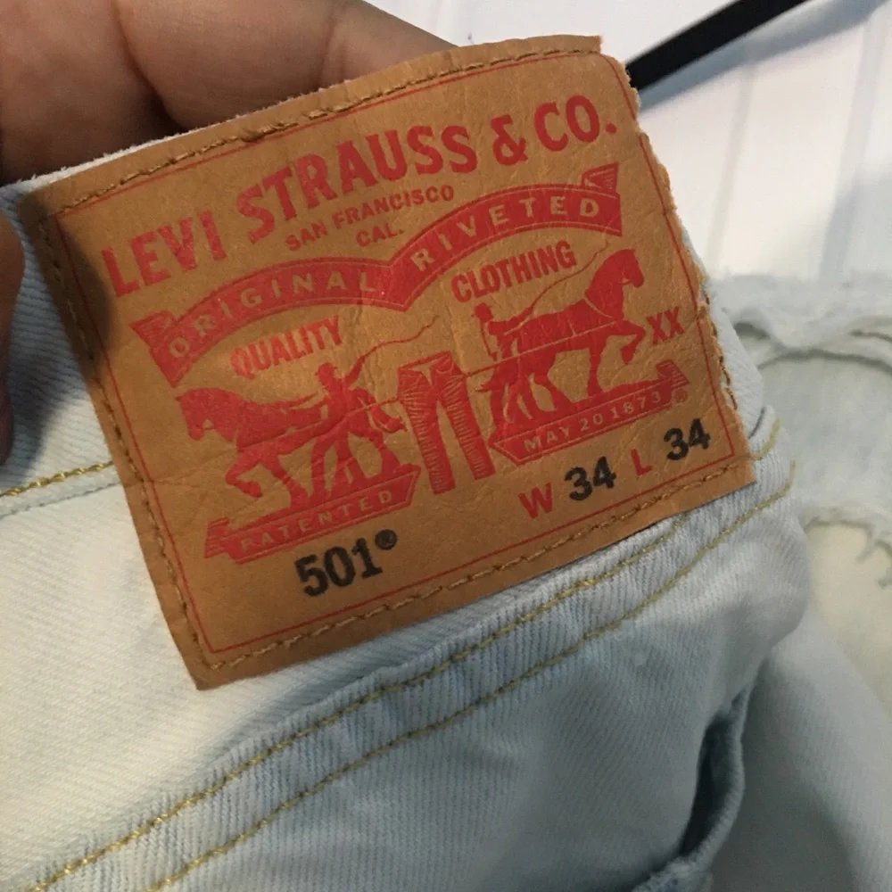 Levi’s 501 light(white) washed ripped jeans